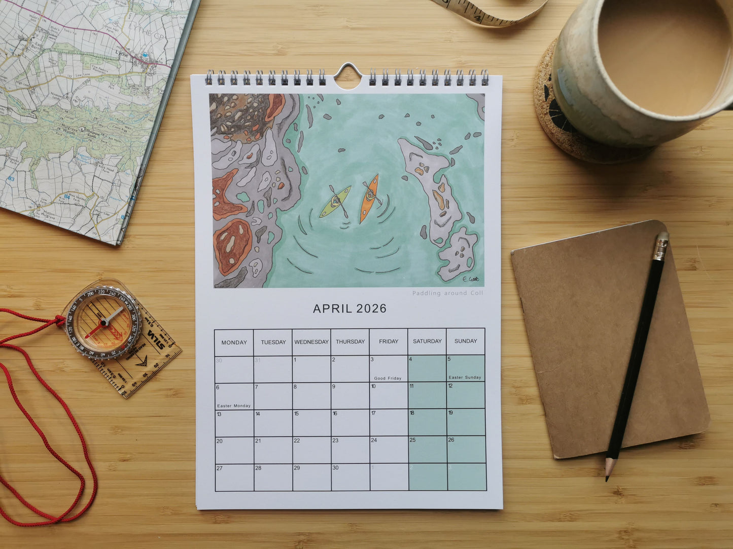 Calendar with design of two people paddling using kayaks. 