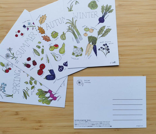 Set of four postcards with seasonal vegetable illustrations and recipes on a wooden surface.